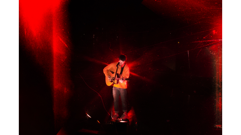 red grunge overhead photo of singer