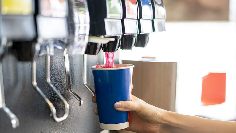 Man pours a fizzy drink.sparkling water.cool ice soft drink cola