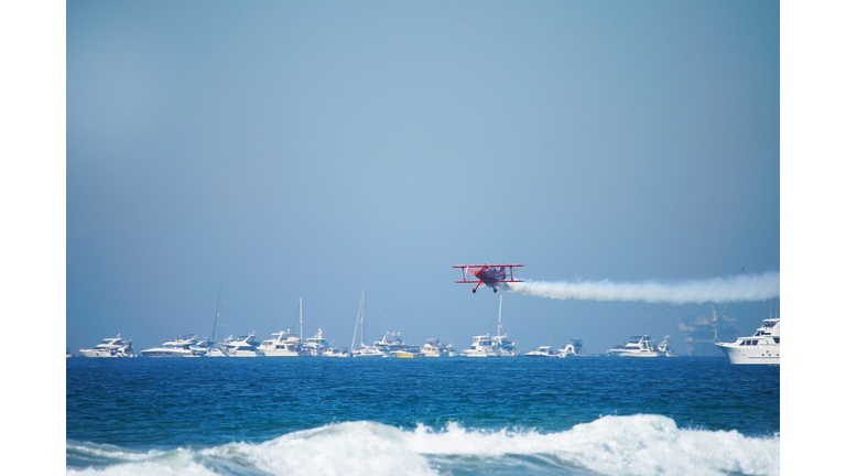 Bi Plane Soars Over Ocean