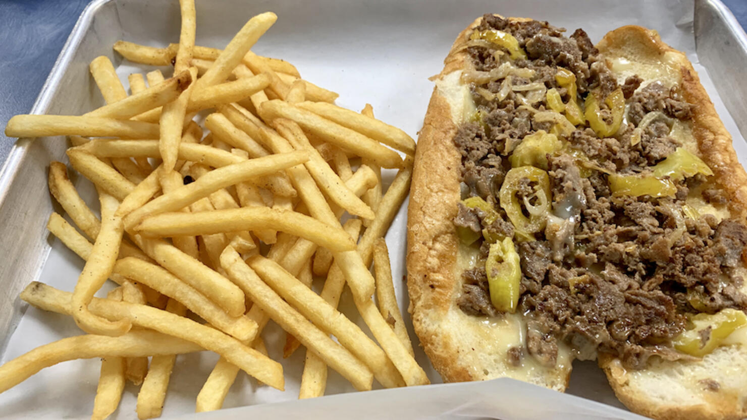 Philly cheesesteak and fresh fried potatoes
