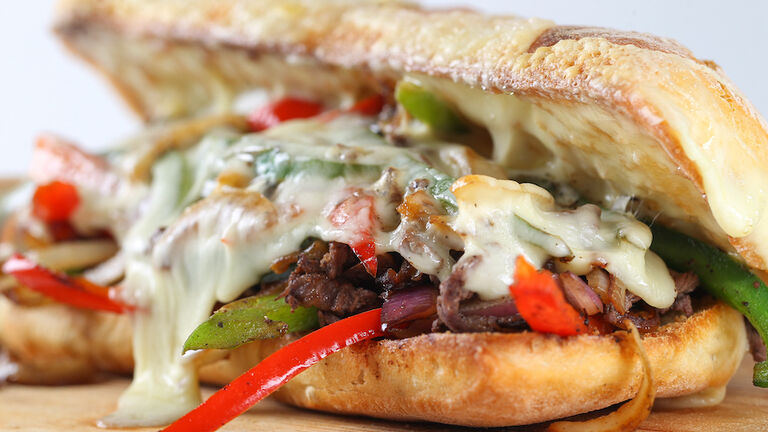 Tasty beef steak sandwich with onions, mushroom