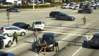 WATCH: Bystanders Stop Runaway Car After Driver Has Medical Episode