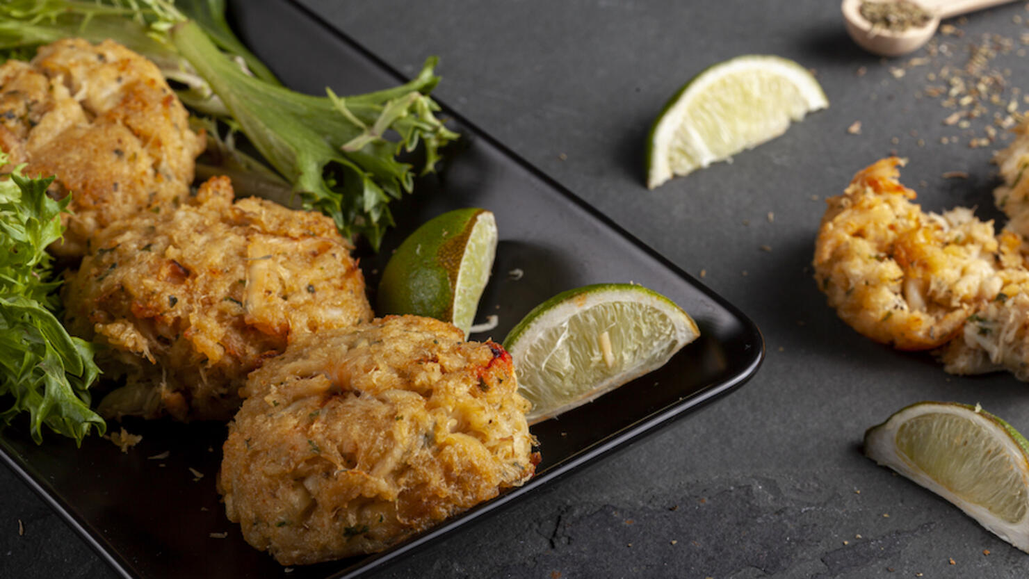 famous maryland crab cakes with side dishes and dipping sauce