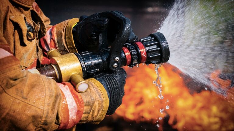 Firefighters Extinguishing House Fire.