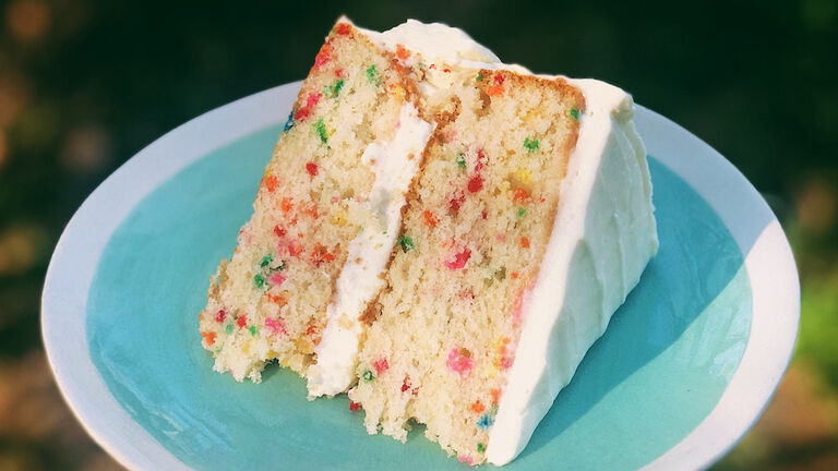 Close-Up Of Hand Holding Cake