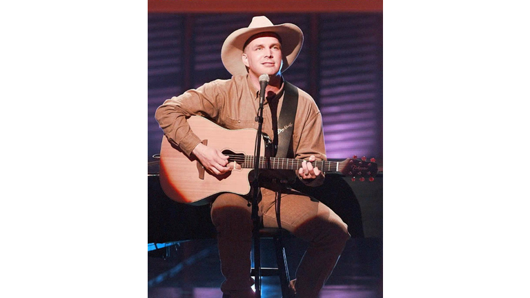Country music artist Garth Brooks preforms his son