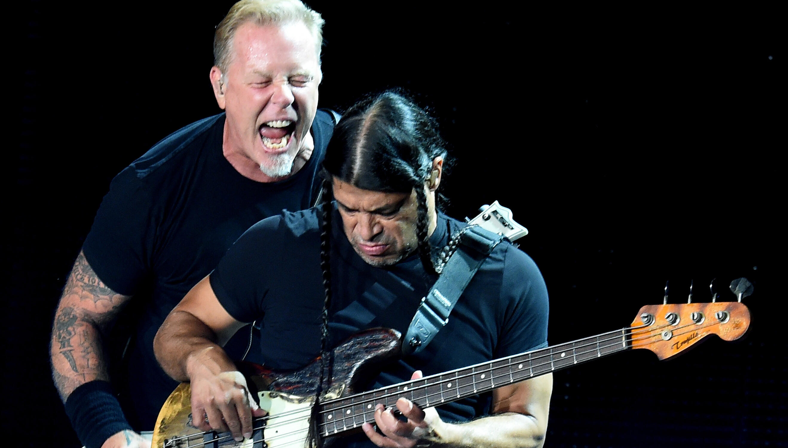 Metallica members, from left, Robert Trujillo, James Hetfield and