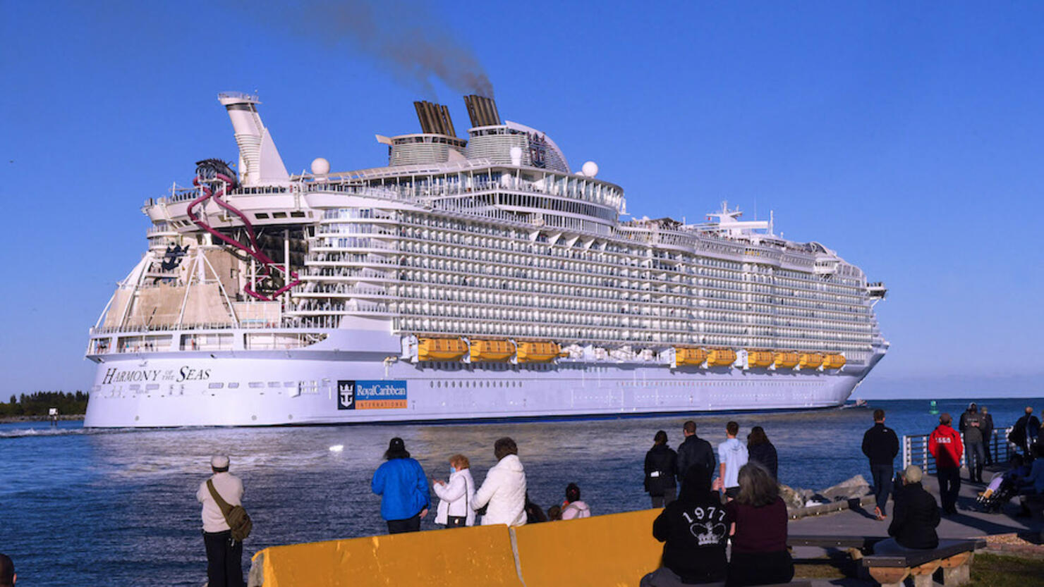 People watch as the Royal Caribbean Harmony of the Seas