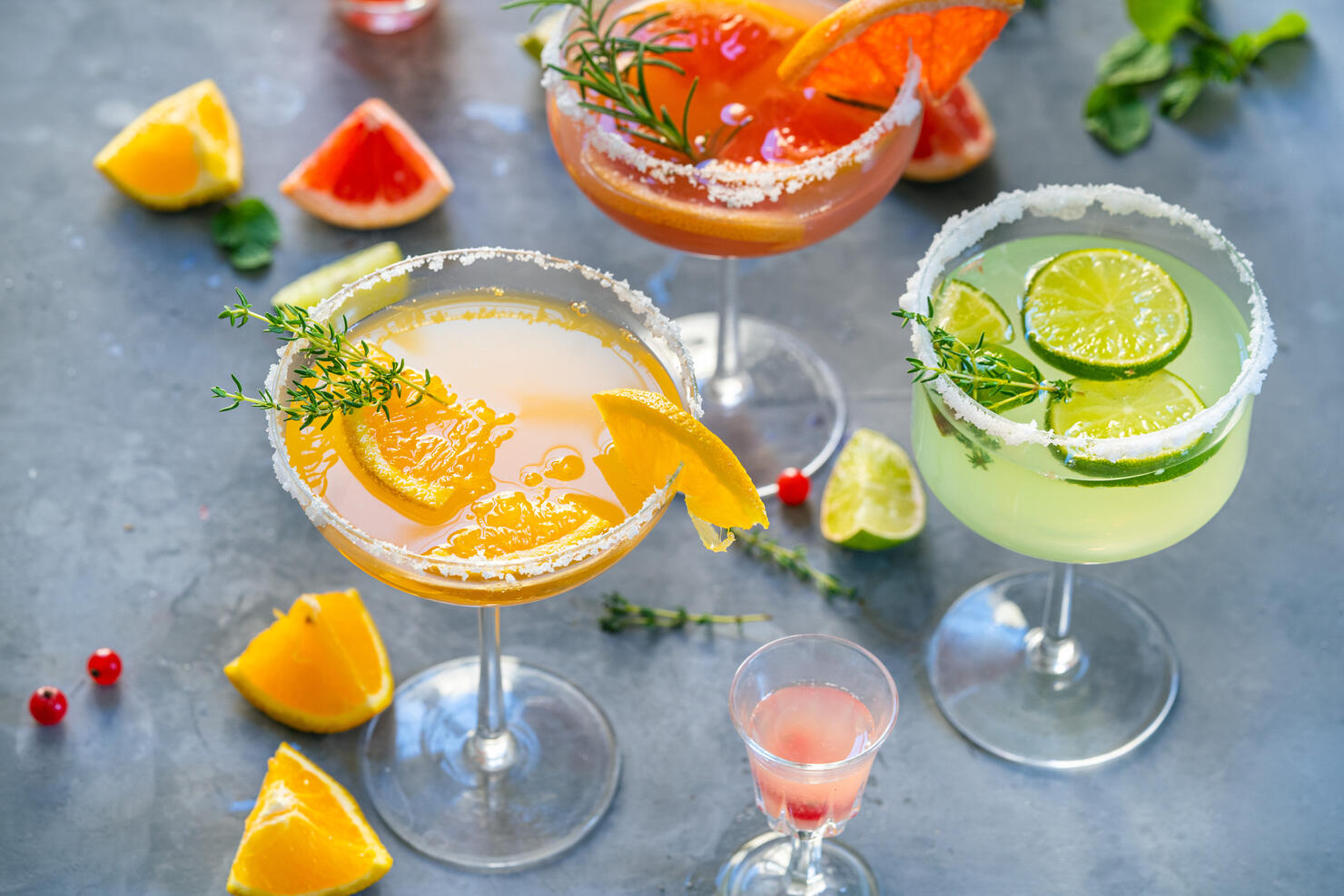 Different cocktails with fruits and herbs