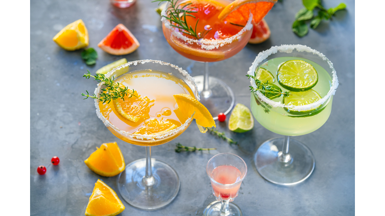 Different cocktails with fruits and herbs