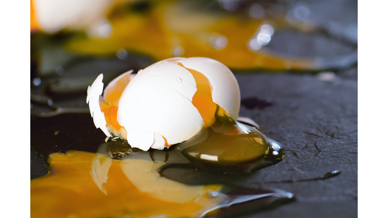 Broken eggs on kitchen floor