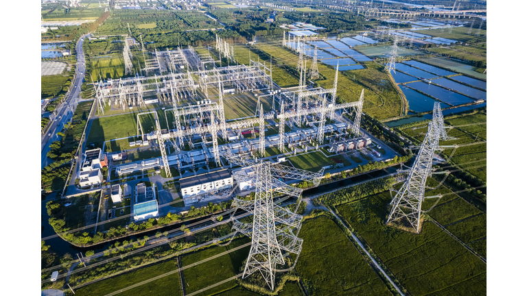 Aerial view of Electricity pylons and a big  Electrical substation at Shanghai city,China