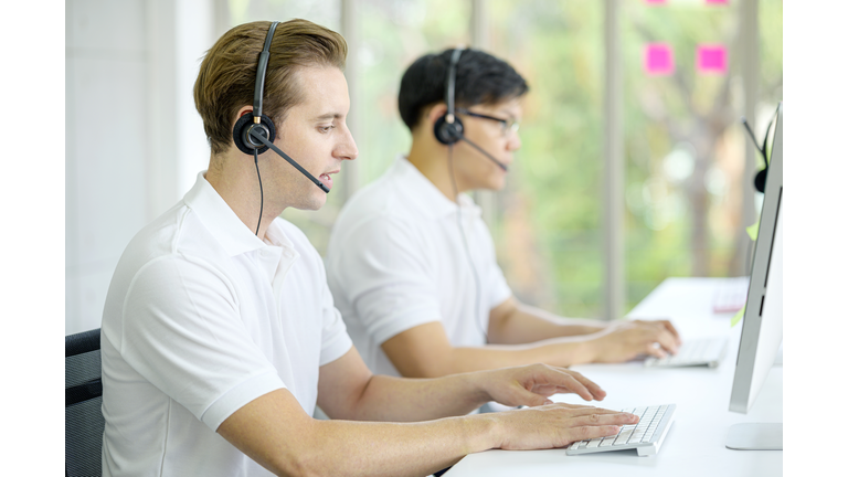 Professional team business call center operator in the office. Service support, Customer service support, Help desk concept.