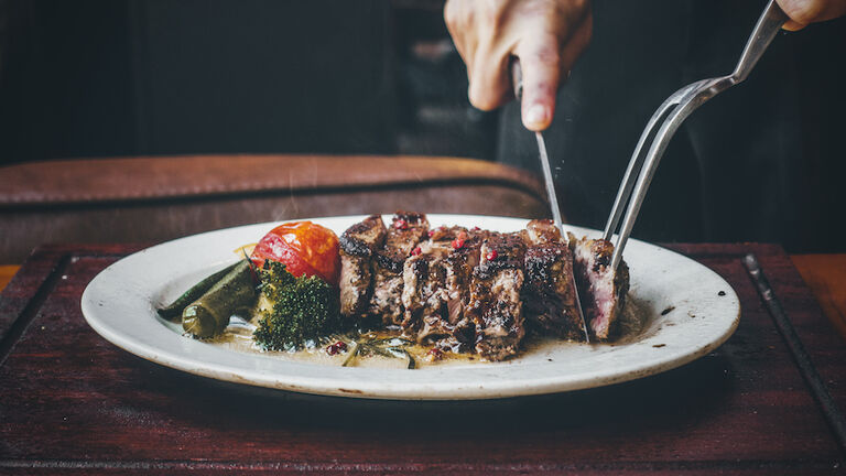 cutting the steak