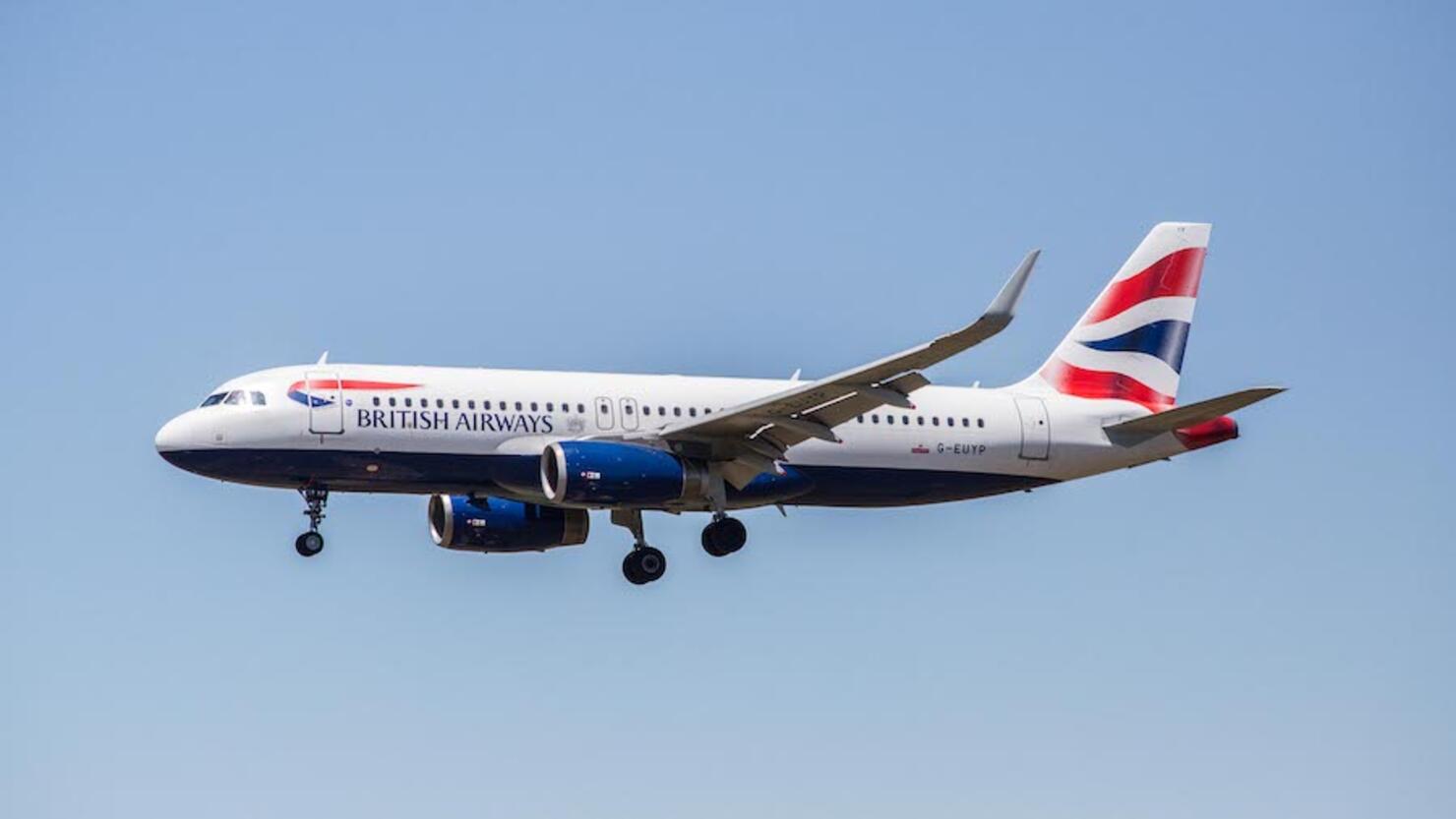 A British Airways airplane is seen landing at El Prat