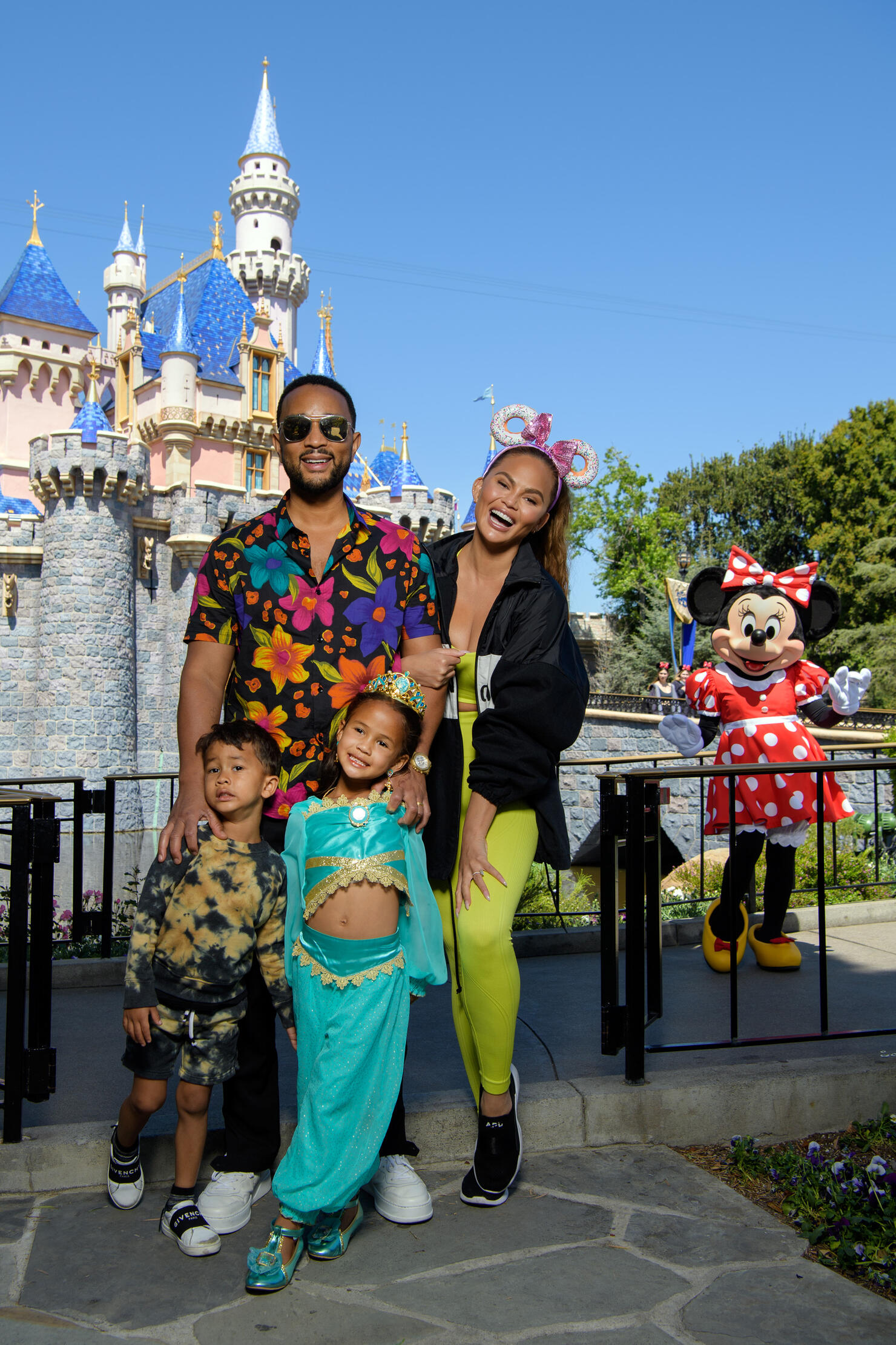 Chrissy Teigen And John Legend Visit Disneyland Resort in Anaheim, California