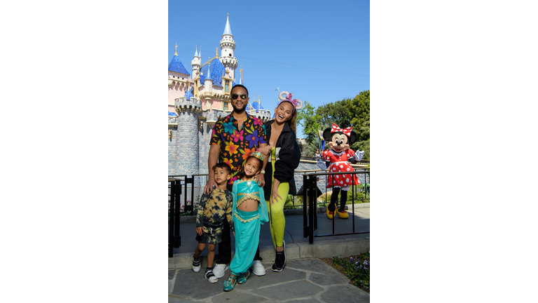 Chrissy Teigen And John Legend Visit Disneyland Resort in Anaheim, California