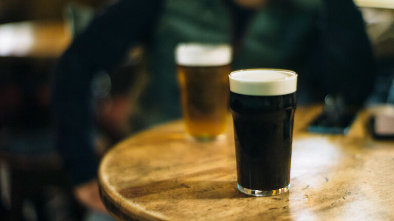 Pints of beer at the pub, smiling guy