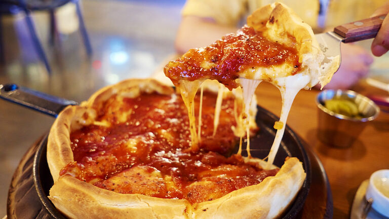 Margharita Pizza In Pan With Hand In Restaurant