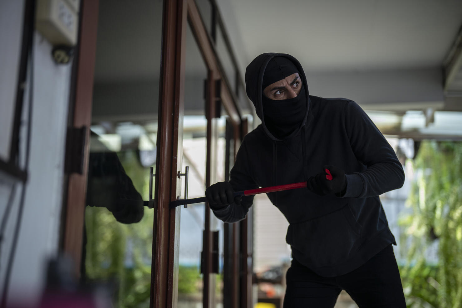 Robber breaking in house