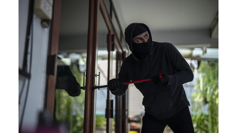 Robber breaking in house