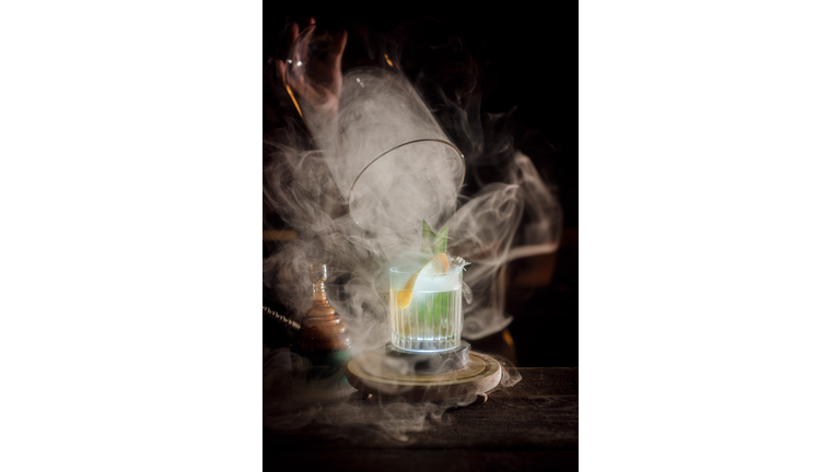 Studio shot alcoholic beverage with smoke effect