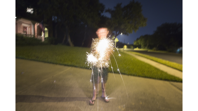 Boy playing with sparklers