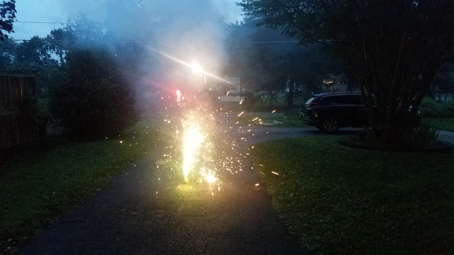 bright colorful fireworks in driveway with sparks