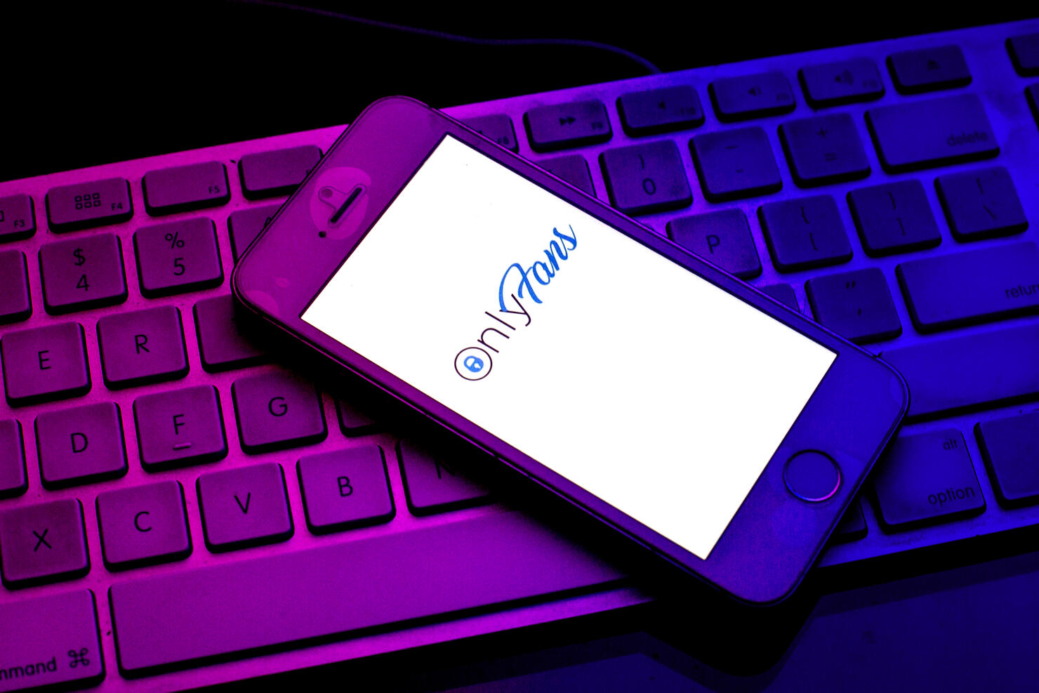 In this photo illustration an OnlyFans logo seen displayed