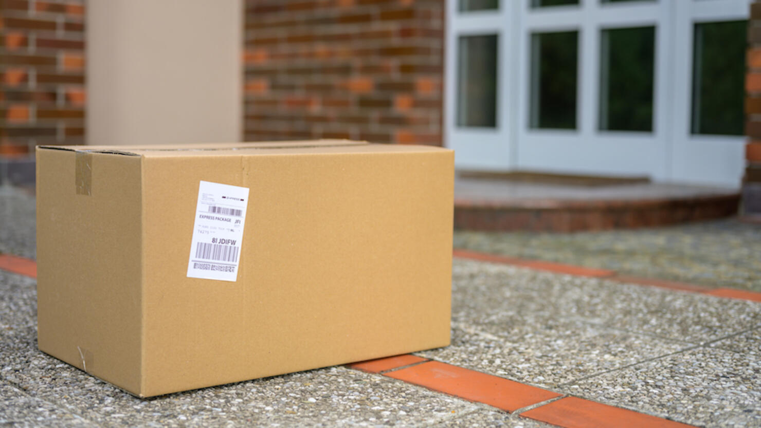 Cardboard package at the doorstep during coronavirus pandemic