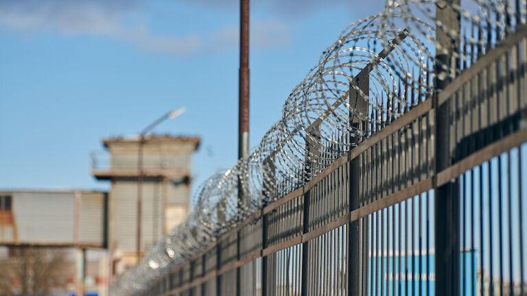 Barbed Wire On Fence, Steel Grating Fence, Metal Fence Wire. Private Area, Protection, Safety