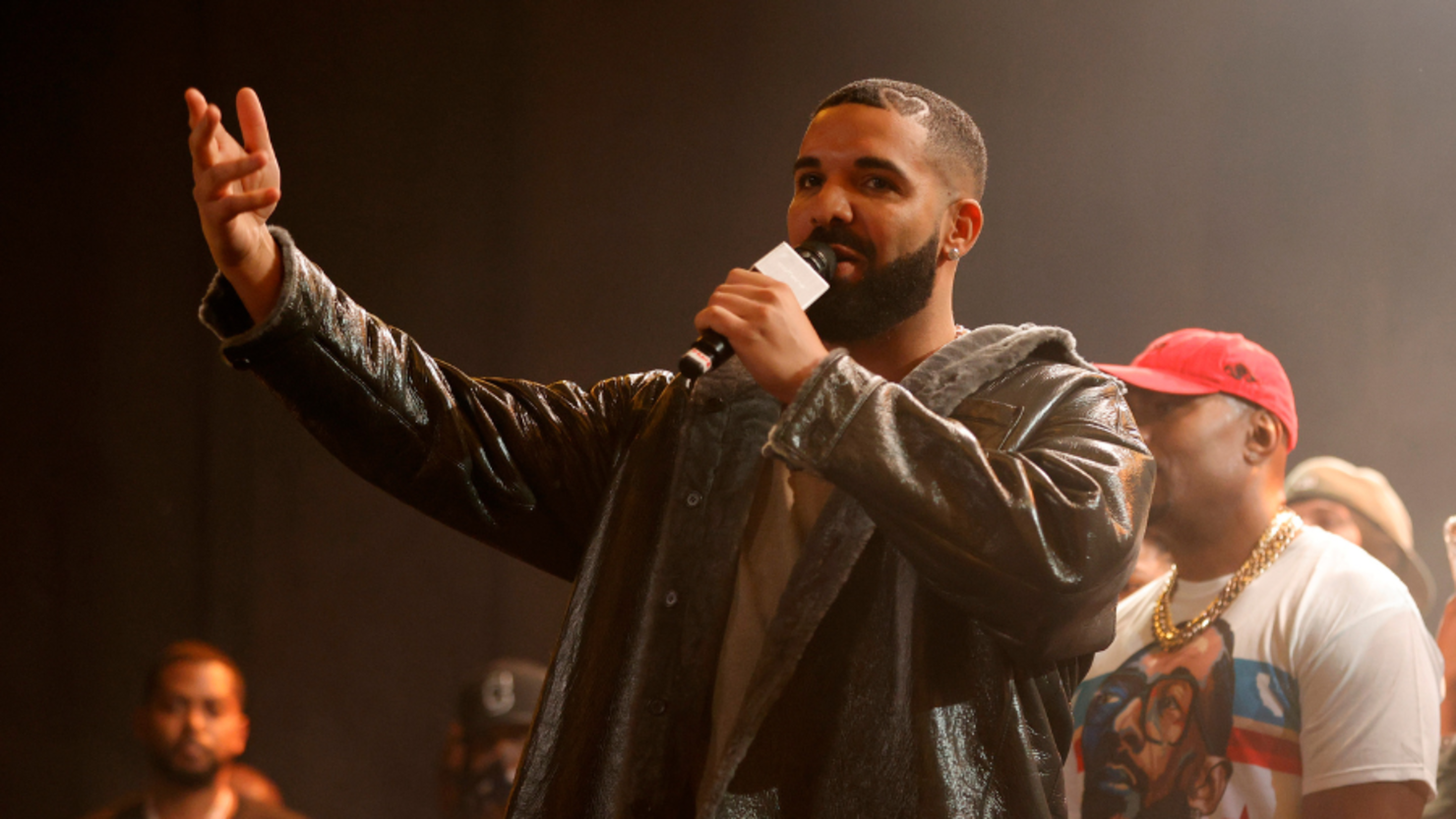 Alix Earle Attends Drake Concert in Low Rise Cargo Pants and a Crop Top  with Underboob Cut Outs