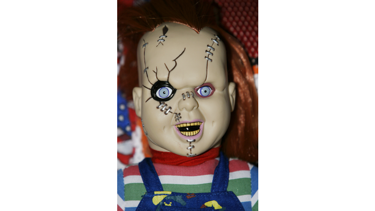 A fan displays a Chucky doll