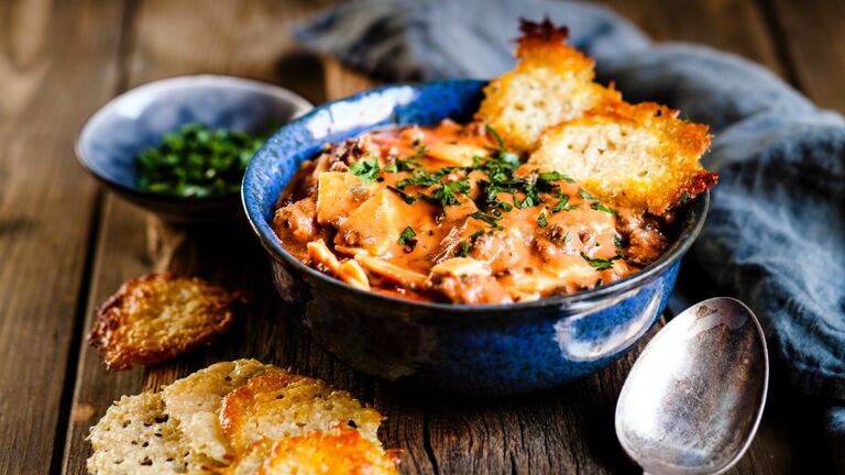 Lasagna soup, deconstructed lasagna served as soup, with parmesan crisps