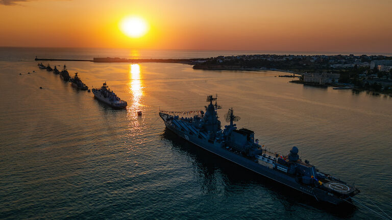 Russian military ship in Sevastopol bay at Navy day, aerial view