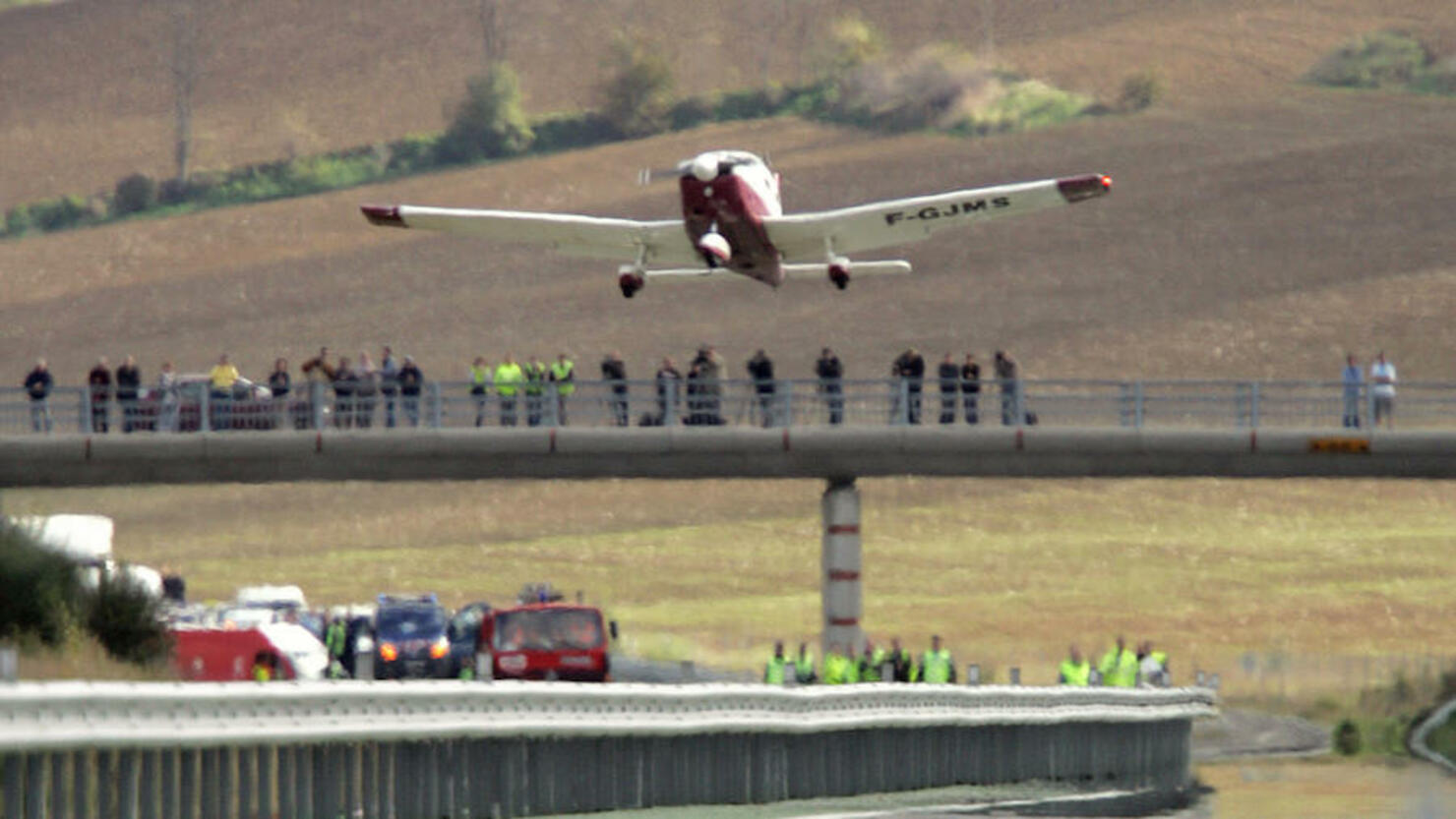 A Piper PA28 takes off from a freeway, 1