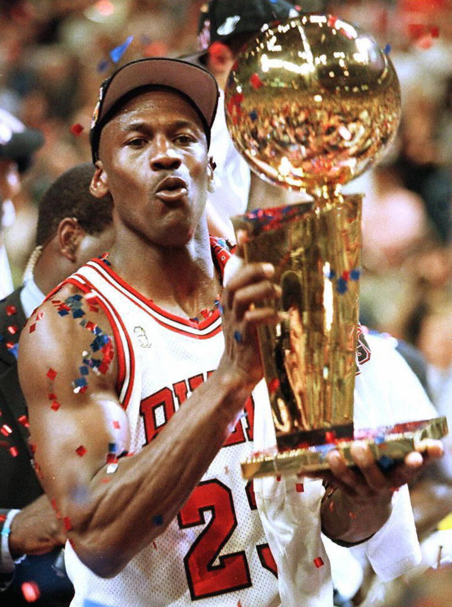 Michael Jordan of the Chicago Bulls holds the Larr