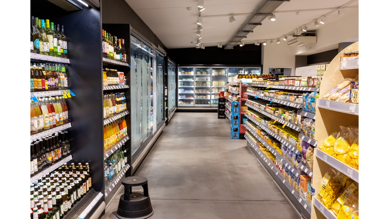 Interior of a supermarket with products displayed on the racks