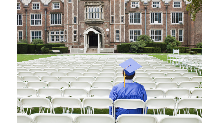 Graduate sitting alone