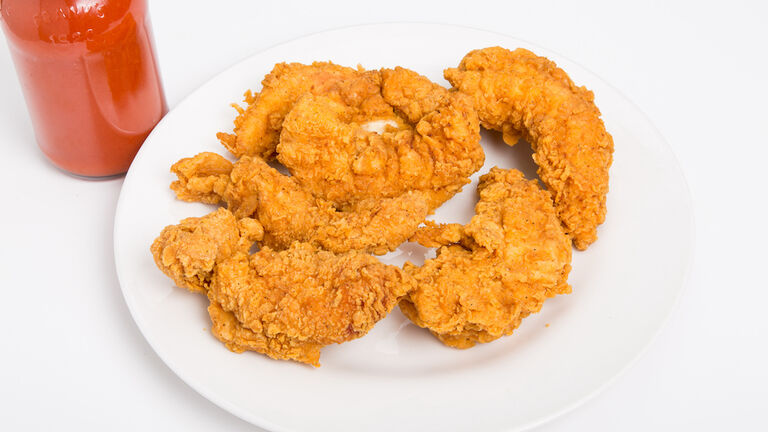 Chicken Strips on White Plate with Hot Sauce