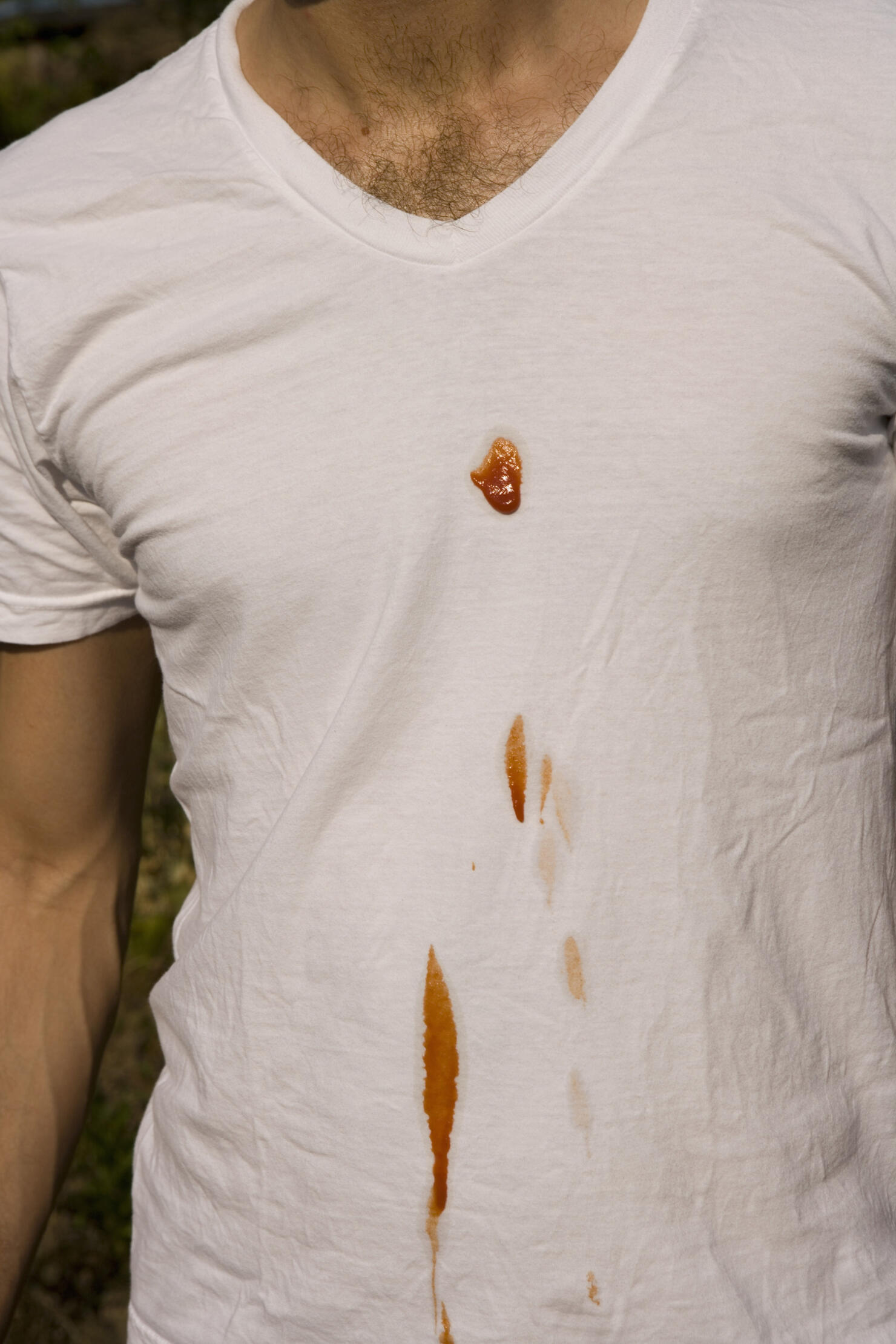 Man with ketchup stain on t-shirt
