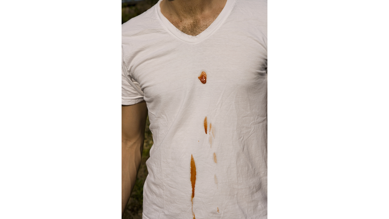 Man with ketchup stain on t-shirt