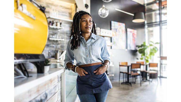 Portrait of female coffeeshop owner in coffeeshop