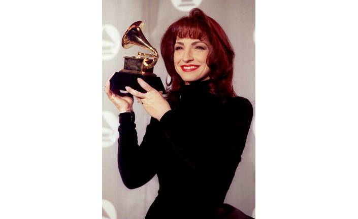 Gloria Estefan holds up the Grammy Award she won 0