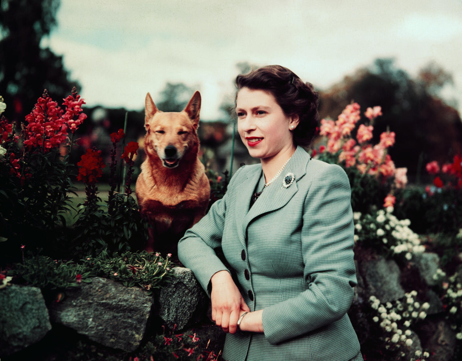 Queen Elizabeth in Garden with Dog