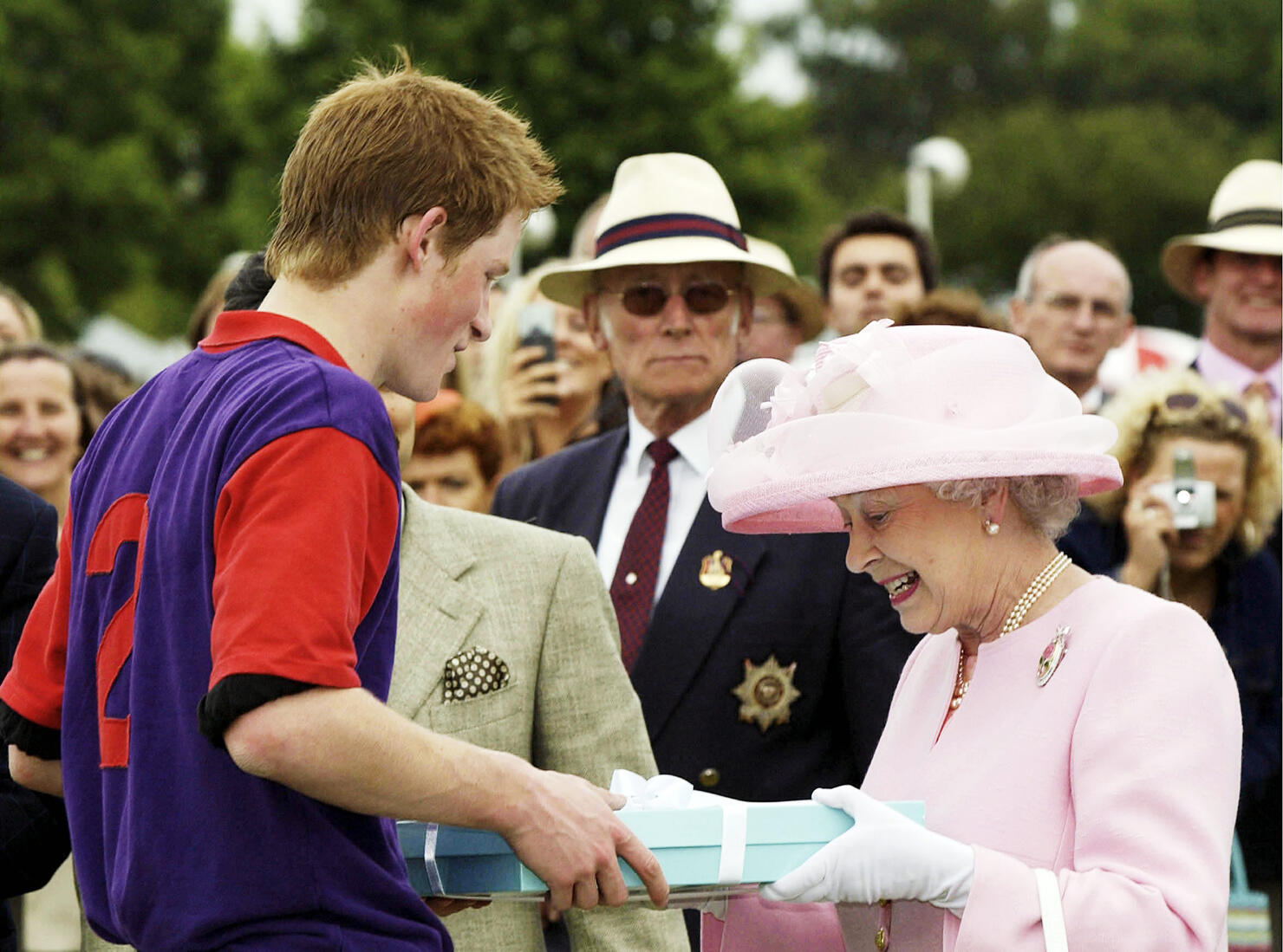 GBR: Queen Elizabeth II makes a presentation to Prince Harry at Royal Ascot