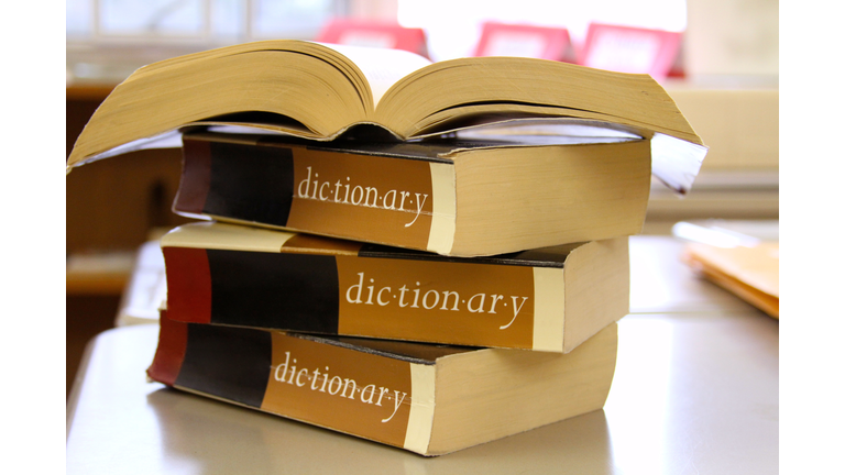 Stack of dictionaries on a desk