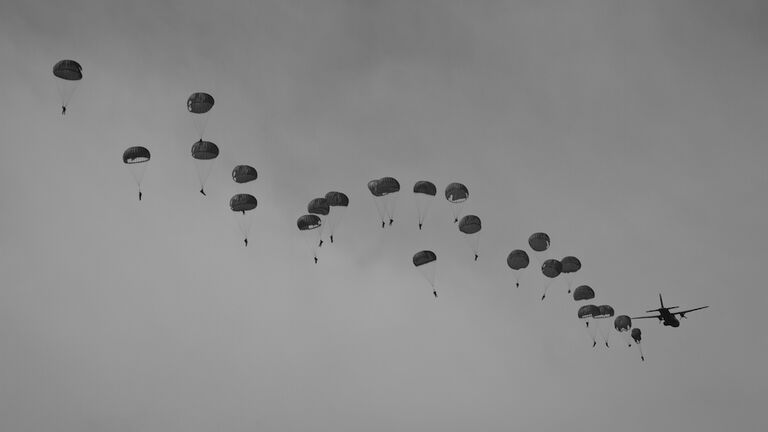 Paratroopers jumping from airplane