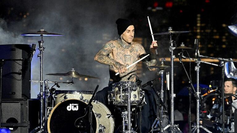 Travis Barker Surprises NYFW With Drum Solo In The Rain iHeart