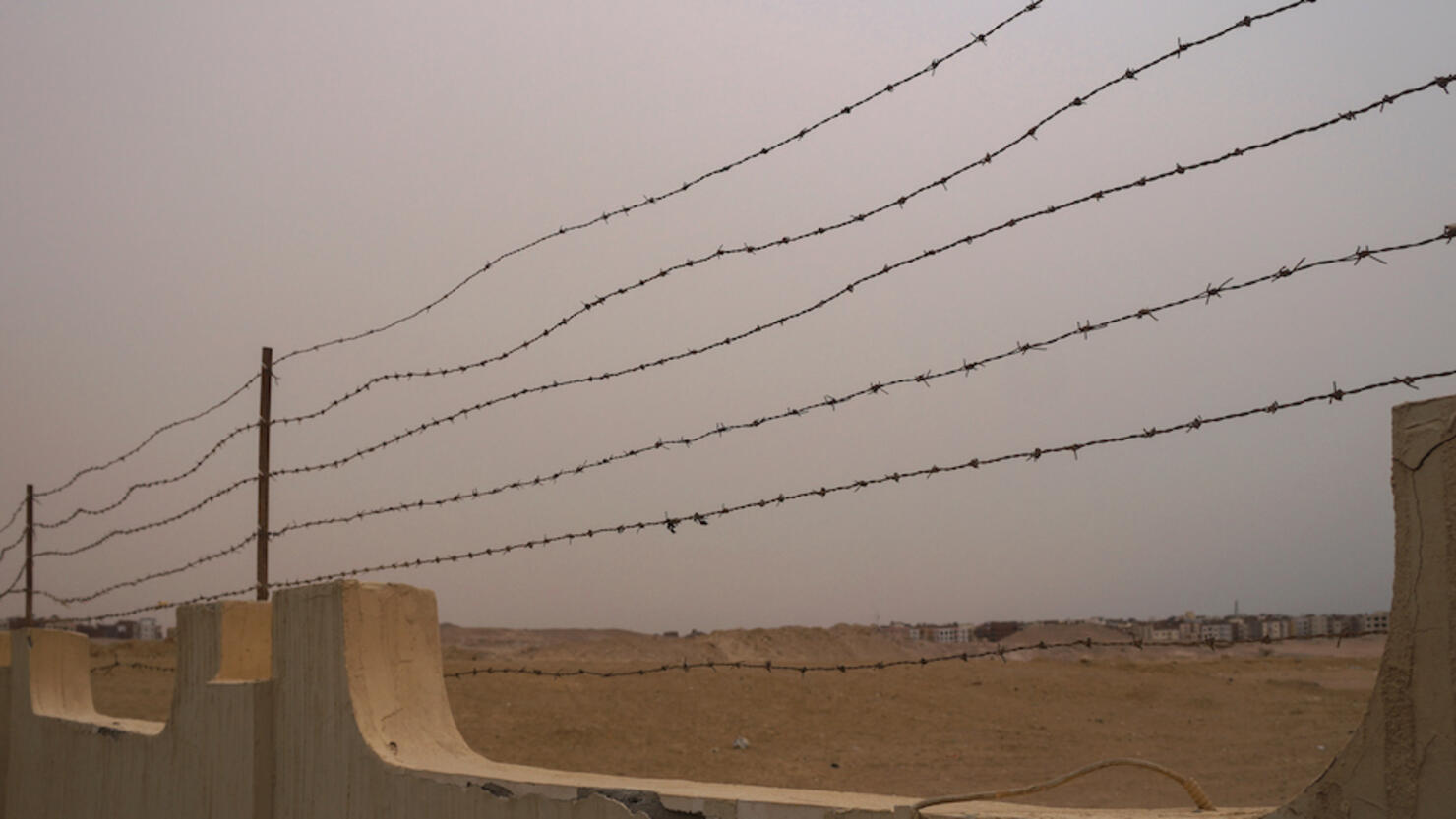 Restrictive fence with barbed wire. Tour area conc camp. Genocide during the war. Stock photo
